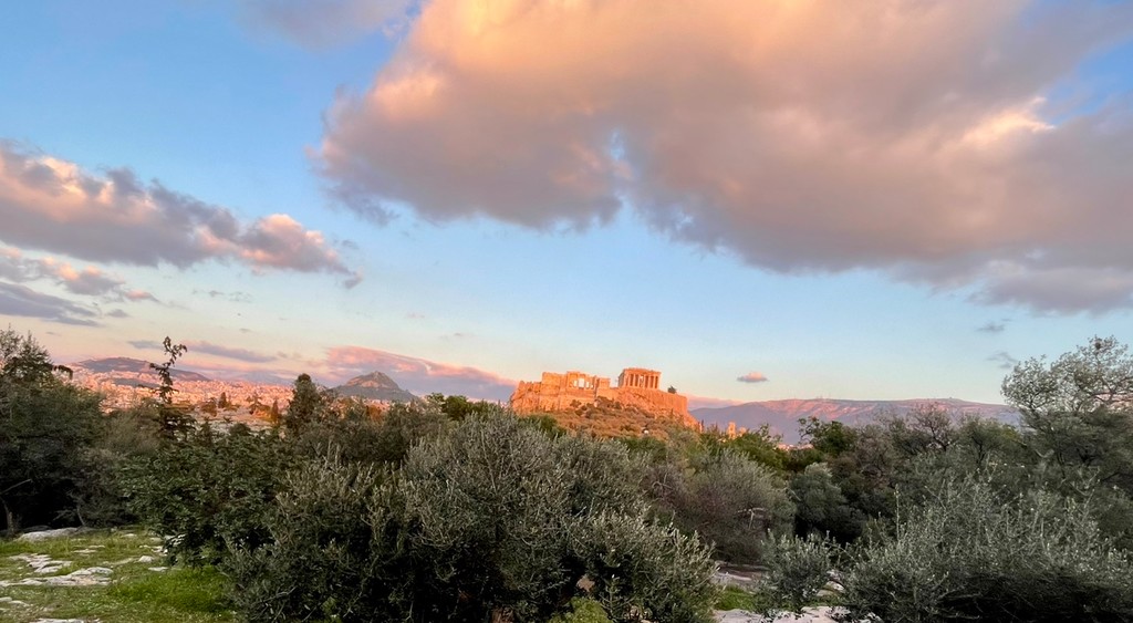 Sunset view over Athens from Pnyx Hill with the Acropolis visible